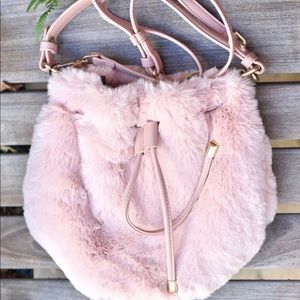 the purr-fect pink fur bucket bag! Available now